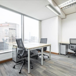 Bright private office with desks and panoramic city views at Central Plaza, Wanchai, Hong Kong