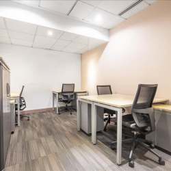 Private office space featuring multiple desks and grey ergonomic chairs in Wanchai, Hong Kong